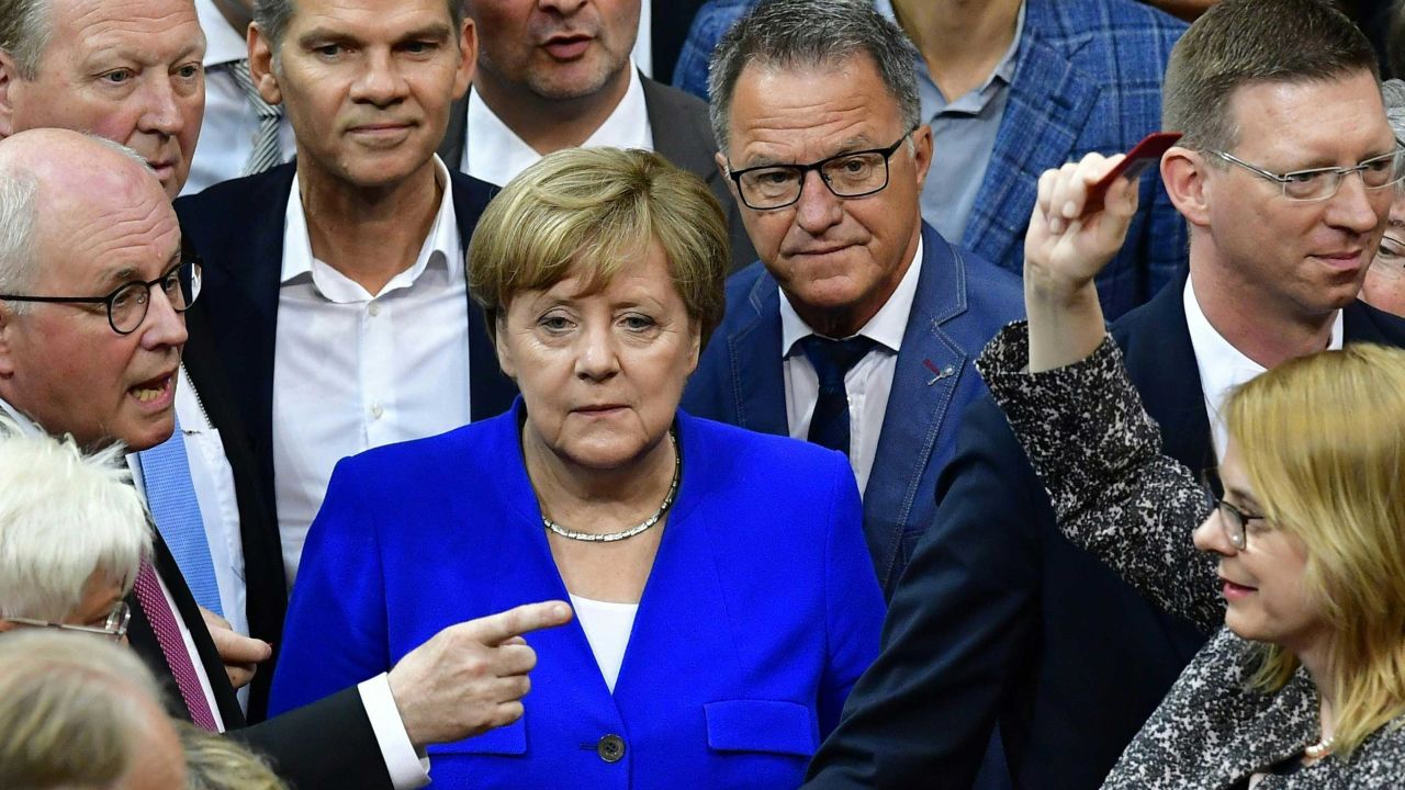 Chancellor Angela Merkel and other lawmakers line up to vote on same-sex marriage.
