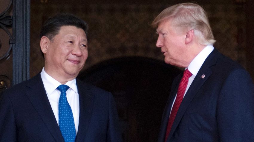 US President Donald Trump (R) welcomes Chinese President Xi Jinping (L) to the Mar-a-Lago estate in West Palm Beach, Florida, on April 6, 2017. / AFP PHOTO / JIM WATSON        (Photo credit should read JIM WATSON/AFP/Getty Images)