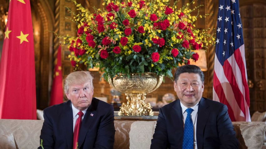 (FILES) US President Donald Trump (L) sits with Chinese President Xi Jinping (R) during a bilateral meeting at the Mar-a-Lago estate in West Palm Beach, Florida, on April 6, 2017.While the new US president has shown a capacity to change, both his tone and his positions, he has been unable to show the world a "new" Trump, with a steady presidential style and a clearly articulated worldview. As the symbolic milestone of his 100th day in power, which falls on April 29, 2017, draws near, a cold, hard reality is setting in for the billionaire businessman who promised Americans he would "win, win, win" for them. At this stage of his presidency, he is the least popular US leader in modern history (even if his core supporters are still totally behind him.) / AFP PHOTO / JIM WATSON / TO GO WITH AFP STORY, US-politics-Trump-100days         (Photo credit should read JIM WATSON/AFP/Getty Images)