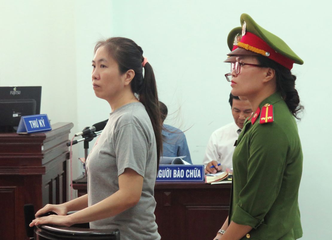 Vietnamese blogger Nguyen Ngoc Nhu Quynh, left, also known as 'Mother Mushroom,' stands trial at a courthouse in the central city of Nha Trang on June 29, 2017.