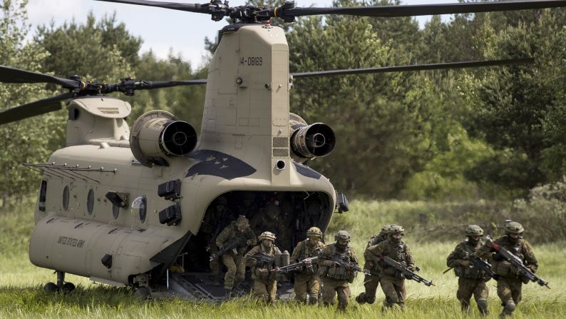 Soldiers aboard a U.S. Air Force CH-47 Chinook helicopter take part in the NATO military exercise 'Iron Wolf 2017' at a training range in Pabrade, Lithuania on June 22. The exercise, being held in different parts of Lithuania, will involve roughly 5,000 participants from Lithuania and nine other NATO allies. 
