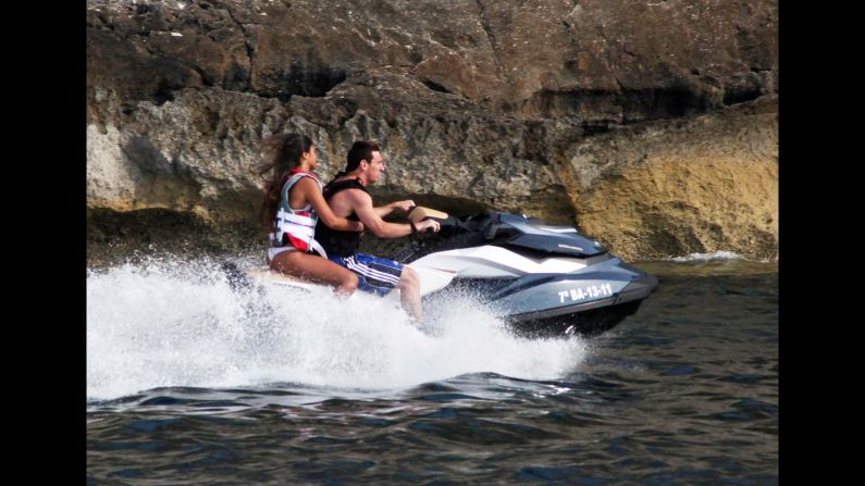 Messi and Roccuzzo ride a jet ski in Ibiza, Spain, in August 2011.