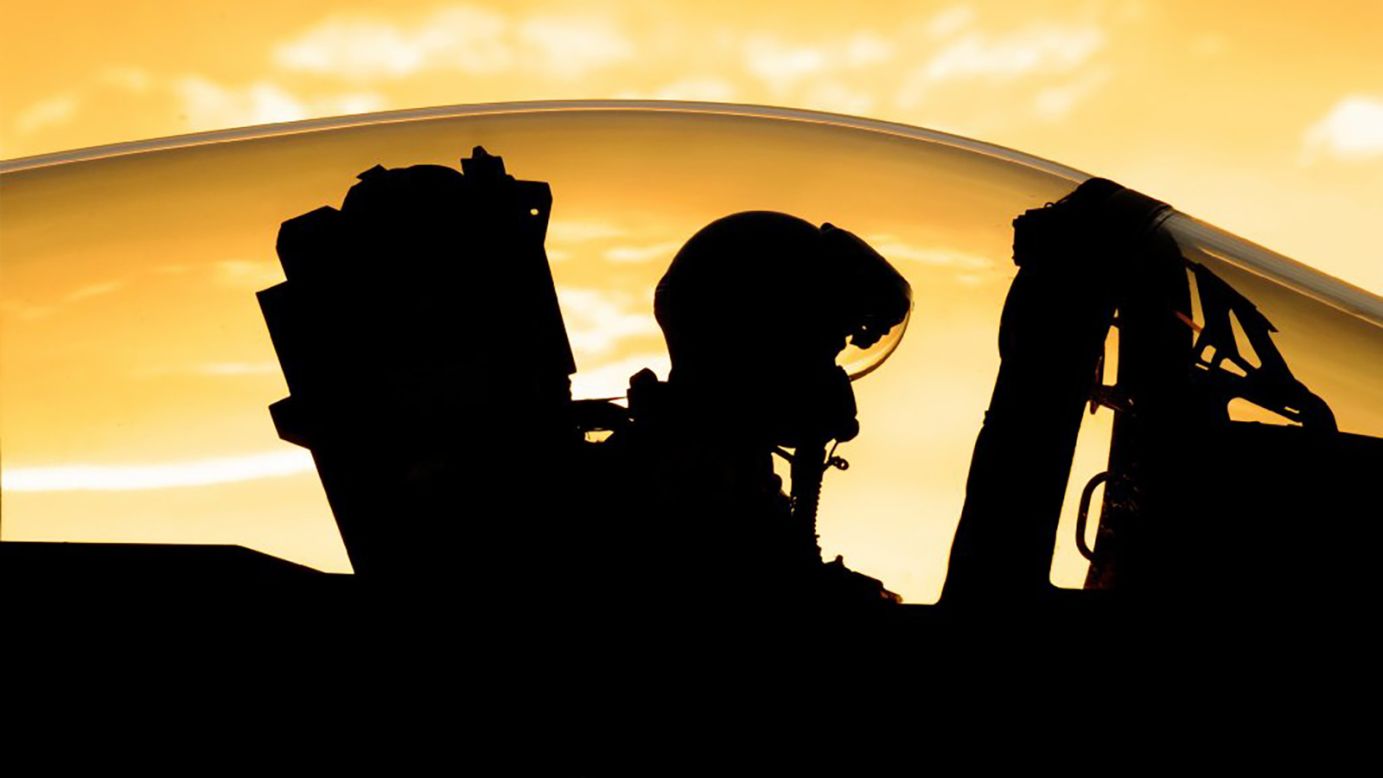 As the sun begins to set at Nellis Air Force Base, near Las Vegas, Oregon Air National Guard Lt. Col. Nick Rutgers, prepares his F-15 Eagle for a late day sortie on June 8. 