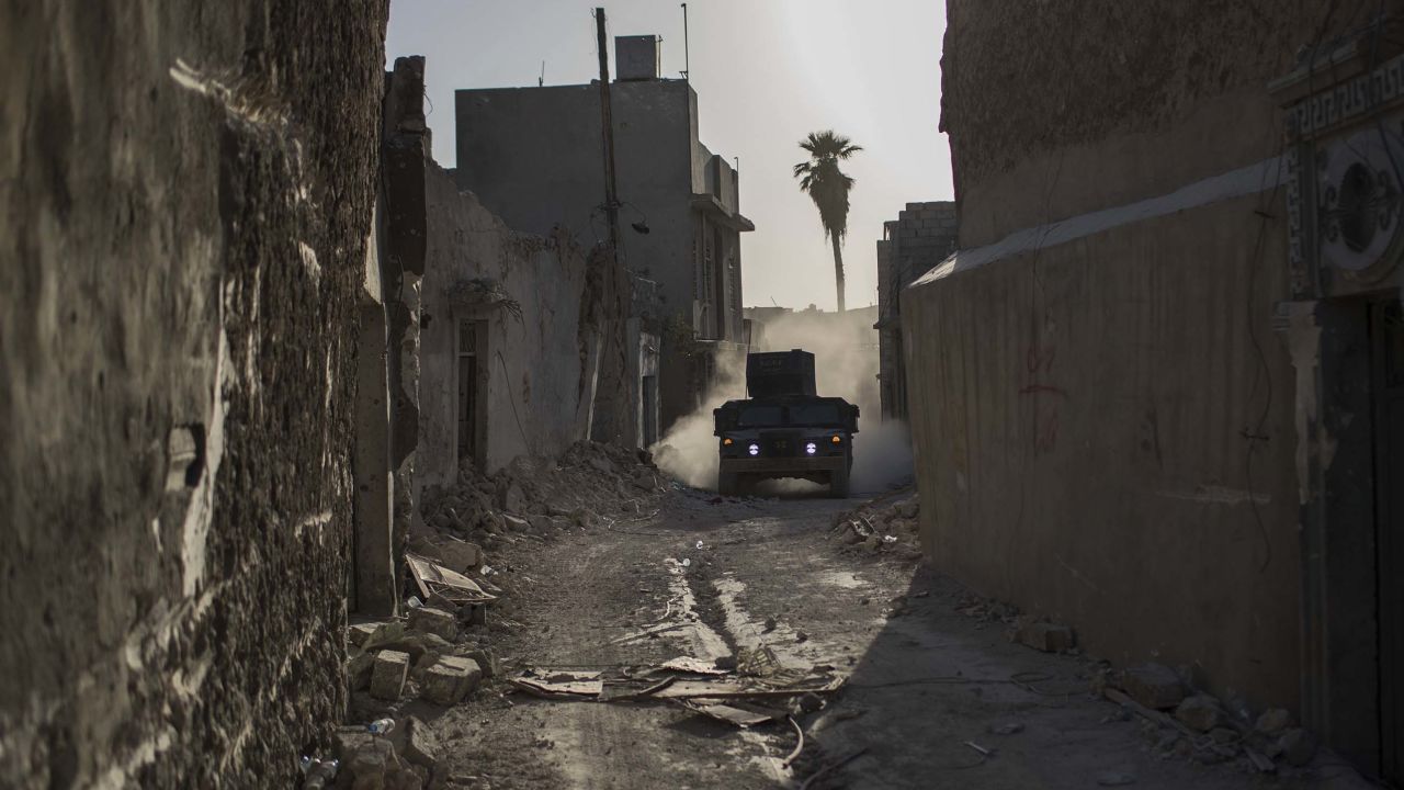 An Iraqi special forces humvee rides through the Old City as fighting continues against ISIS militants in Mosul on Thursday.