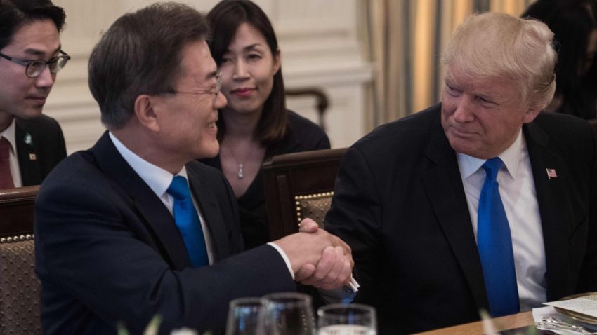US President Donald Trump and South Korean President Moon Jae-in shake hands before dinner at the White House in Washington, DC, on June 29, 2017. / AFP PHOTO / NICHOLAS KAMM        (Photo credit should read NICHOLAS KAMM/AFP/Getty Images)