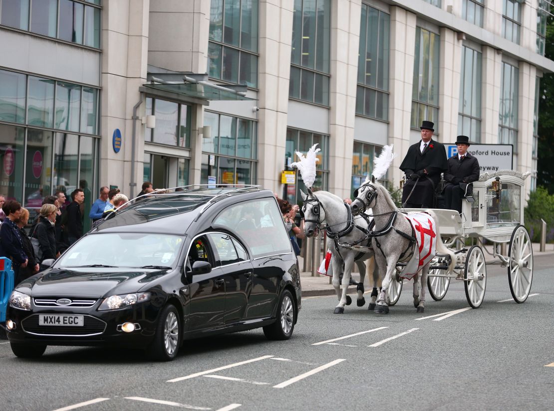 Martyn Hett's coffin -- covered with Coronation Street images -- arrives for his funeral.