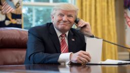 US President Donald Trump waits to speak on the phone with Irish Prime Minister Leo Varadkar to congratulate him on his recent election victory in the Oval Office at the White House in Washington, DC, on June 27.