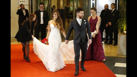 Soccer star Lionel Messi, right, and Antonela Rocuzzo pose for pictures at their wedding on June 30, 2017 in Rosario, Argentina.