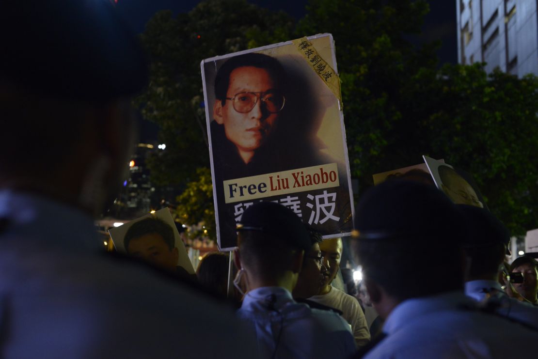 A protester holds up a picture of Chinese dissident Liu Xiaobo on June 30, 2017, in Hong Kong.