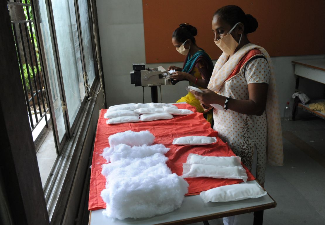 Members of Self Employed Women's Association (SEWA) make low cost sanitary pads at their facility in Ahmedabad on September 3, 2012.