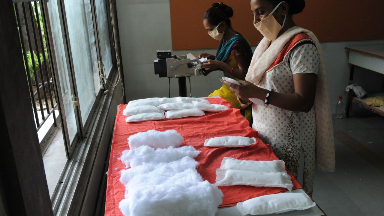 Members of Self Employed Women's Association (SEWA) make low cost sanitary pads at their facility in Ahmedabad on September 3, 2012.  
