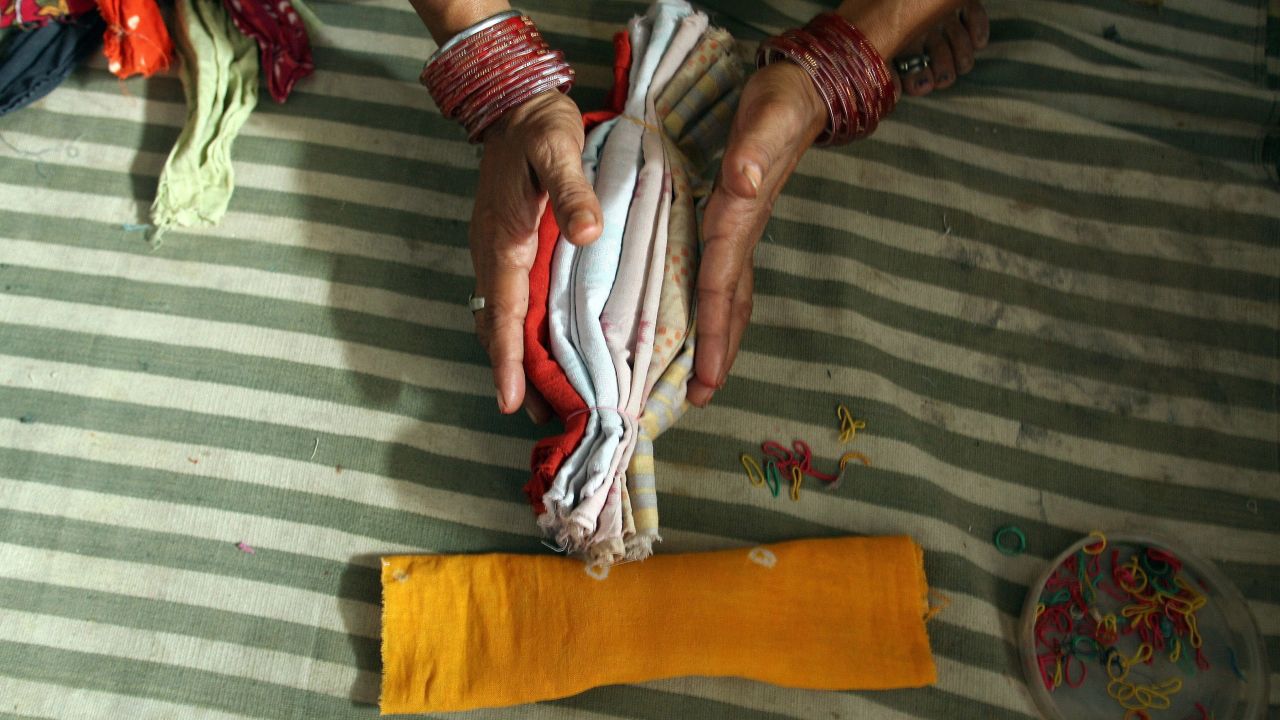 NGOs and aid workers help women make clean and cheap sanitary napkins.