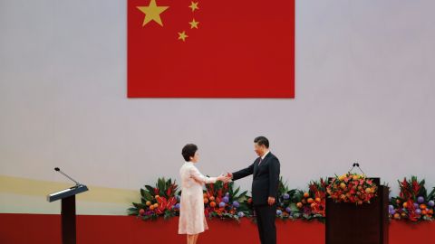Chinese President Xi Jinping, right, shakes hands with Hong Kong's new Chief Executive Carrie Lam after Xi administered her oath-taking ceremony. 
