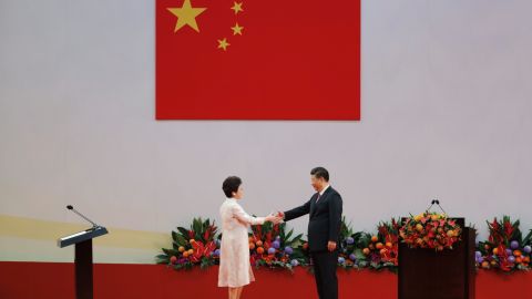 Chinese President Xi Jinping, right, shakes hands with Hong Kong's new Chief Executive Carrie Lam after Xi administered her oath-taking ceremony.