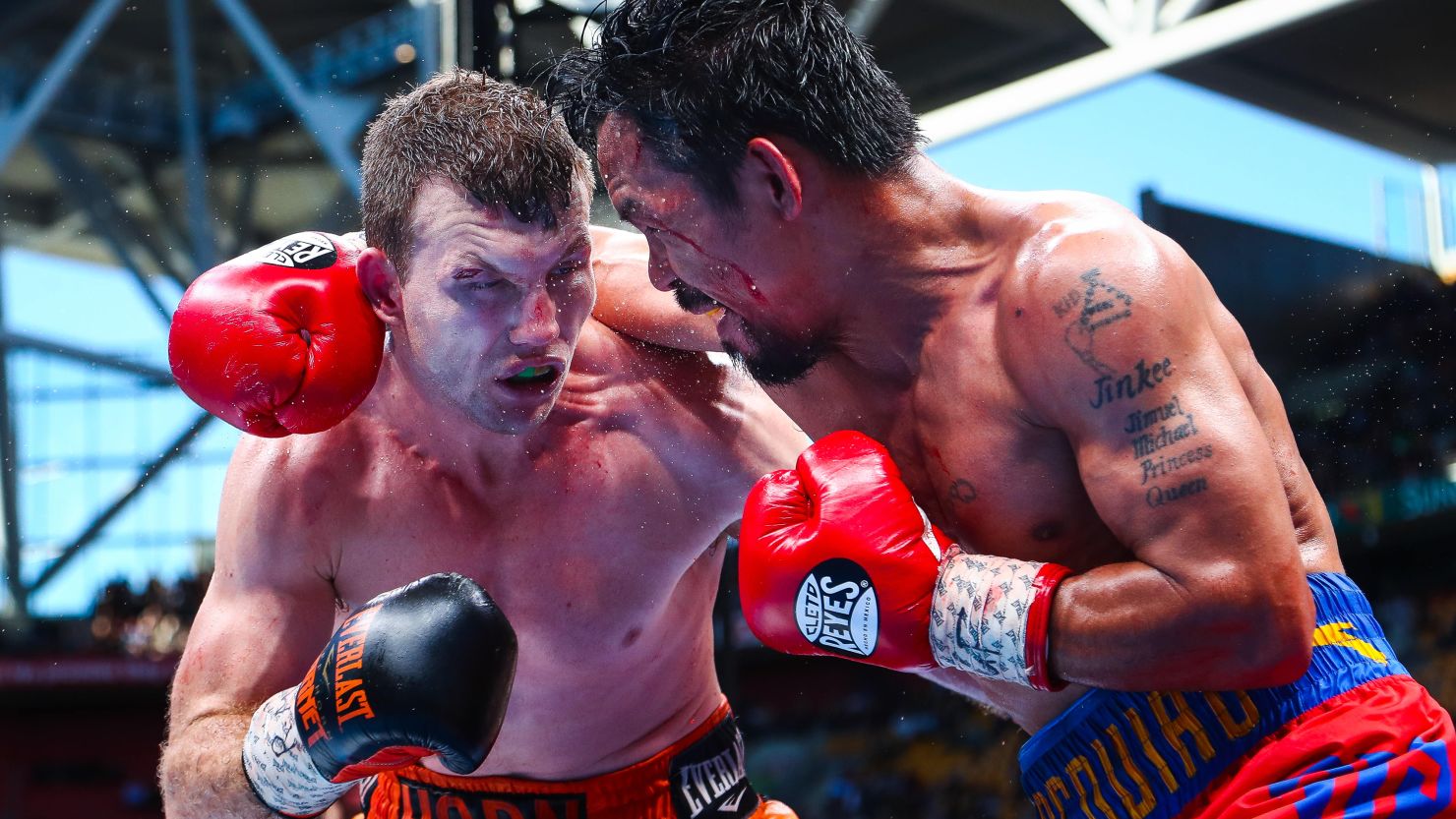 Manny Pacquiao (R) of the Philippines fight Jeff Horn (L) of Australia during the World Boxing Organization boat at Suncorp Stadium in Brisbane on July 1, 2017.  