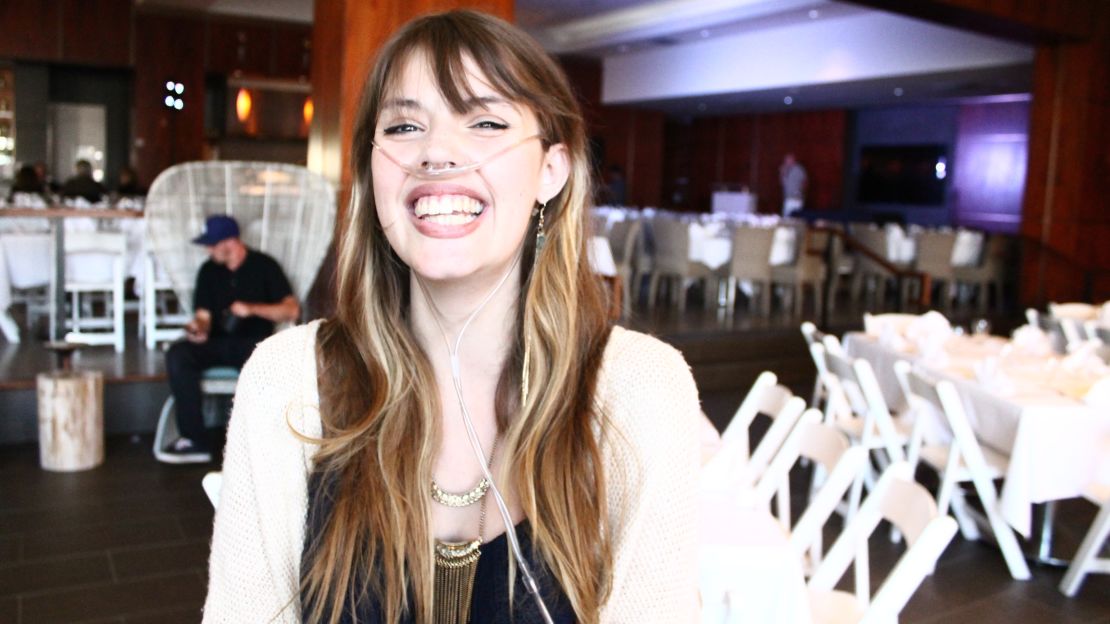 Claire Wineland smiles broadly at a comedy roast to raise money for Claire's Place Foundation in July 2015.