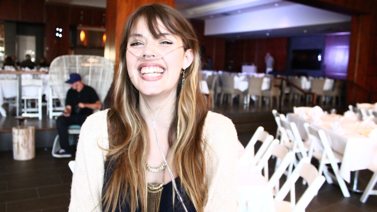 Claire Wineland smiles broadly at a comedy roast to raise money for Claire's Place Foundation in July 2015.