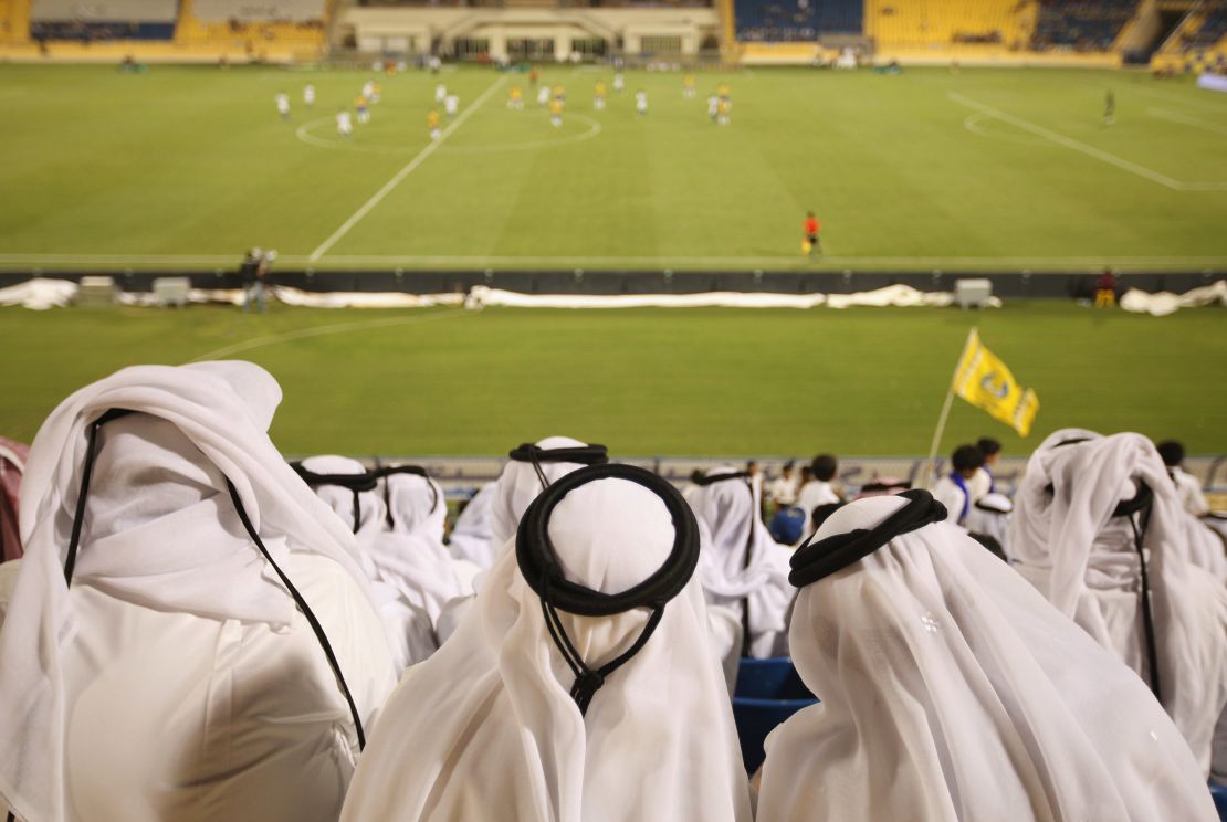 Fans a Qatar Stars League football match.