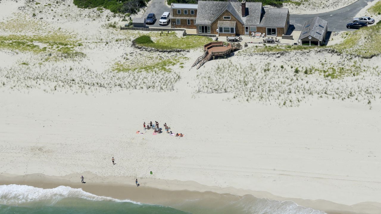 New Jersey Gov. Chris Christie uses the beach with his family and friends at the governor's summer house at Island Beach State Park in New Jersey on July 2. Christie is defending his use of the beach, closed to the public during New Jersey's government shutdown, saying he had previously announced his vacation plans and the media had simply "caught a politician keeping his word."