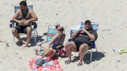 New Jersey Gov. Chris Christie uses the beach with his family and friends at the governor's summer house at Island Beach State Park in New Jersey on July 2. Christie is defending his use of the beach, closed to the public during New Jersey's government shutdown, saying he had previously announced his vacation plans and the media had simply "caught a politician keeping his word."