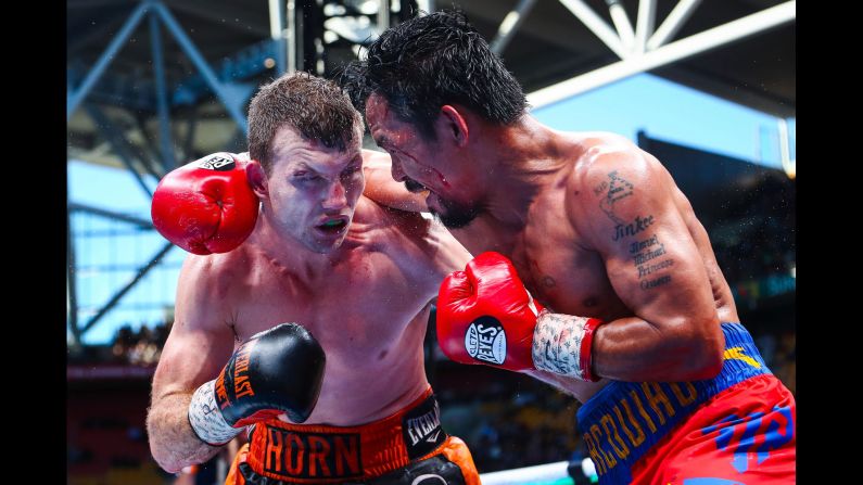 Jeff Horn ducks under a Manny Pacquiao punch during their welterweight title fight in Brisbane, Australia, on Sunday, July 2. Horn won by unanimous decision, <a href="index.php?page=&url=http%3A%2F%2Fwww.cnn.com%2F2017%2F07%2F02%2Fsport%2Fhorn-pacquiao-boxing-brisbane%2Findex.html" target="_blank">but many thought the judges got it wrong.</a>