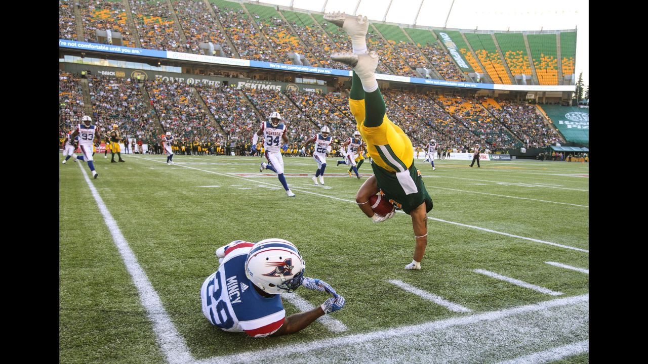 Montreal's Jonathon Mincy tackles Edmonton's Calvin McCarty during a Canadian Football League game on Friday, June 30.