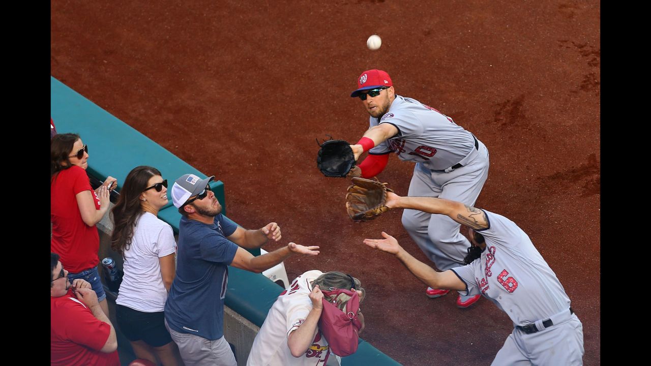Washington's Anthony Rendon, right, and Stephen Drew try to catch a foul ball during a Major League game in St. Louis on Saturday, July 1.
