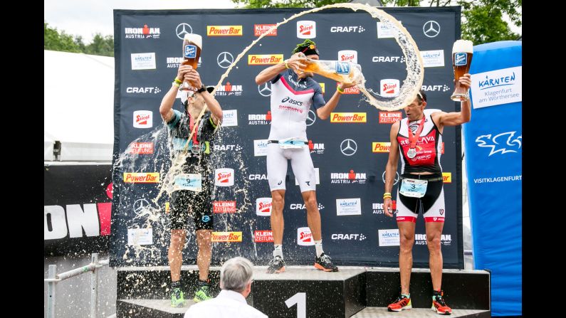 From left, triathletes Eneko Llanos, Jan Frodeno and Viktor Zyemtsev have some fun on the podium following an Ironman race in Klagenfurt, Austria, on Sunday, July 2.