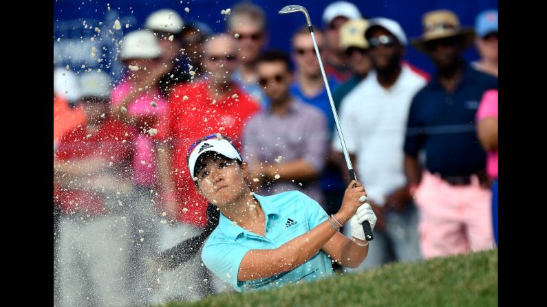 Danielle Kang plays a shot out of the bunker during the third round of the LPGA Championship on Saturday, July 1. The 24-year-old American <a href="index.php?page=&url=http%3A%2F%2Fwww.cnn.com%2F2017%2F07%2F03%2Fgolf%2Fdanielle-kang-lpga-championship-olympia-fields%2Findex.html" target="_blank">won the tournament</a> for her first career major.