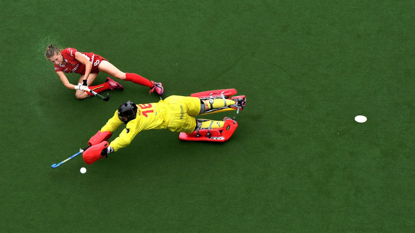 Belgian field-hockey player Stephanie Vanden Borre scores on Spain's Maria Ruiz during a penalty shootout Sunday, July 2, in Brussels, Belgium.
