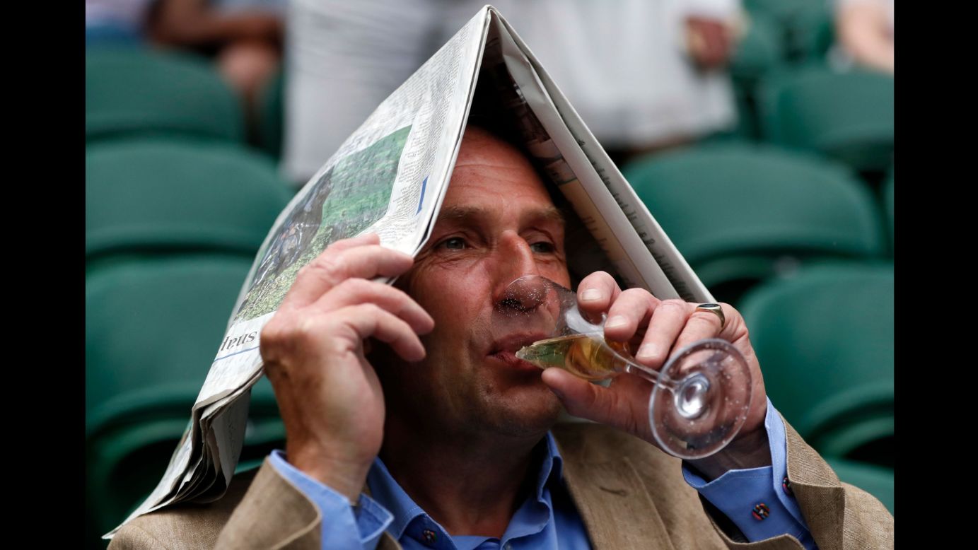 A little rain didn't stop this tennis fan from enjoying Wimbledon on Monday, July 3.