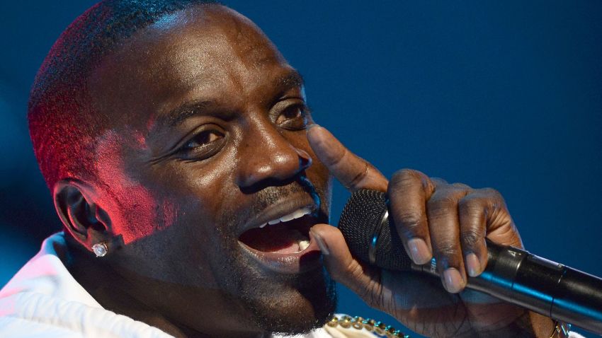 (FILES) This file photo taken on June 3, 2015 shows Senegalese-American rapper Akon performing during the 14th edition of the Mawazine music festival in Rabat. 
Cliched rappers spend money on bling and cars, but Senegalese-American artist Akon is looking skywards to splash his cash, investing in solar power projects across Africa. The rapper added The Gambia and Cape Verde to his Akon Lighting Africa initiative on March 4, 2017, a fund that already helps populations who struggle to connect to limited or absent national grids in 25 African countries. / AFP PHOTO / FADEL SENNAFADEL SENNA/AFP/Getty Images