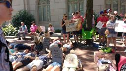 Health care protesters hold "die in" protest outside Sen. Pat Toomey's office in Philadelphia, Pennsylvania.