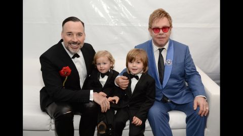 John, Furnish and their two boys pose for a photo in 2015.