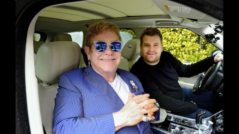 John joins talk-show host James Corden for a a little "carpool karaoke" in 2016.