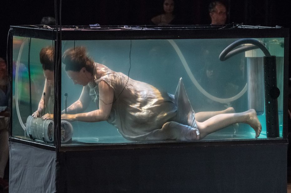 Continuing in the extravagant and avant garde traditions of couture week, models on the Iris Van Herpen runway were accompanied by musicians playing underwater.
