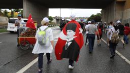 Justice March participant draped in flag with the Turkey's founder Mustafa Kemal Ataturk on it. 