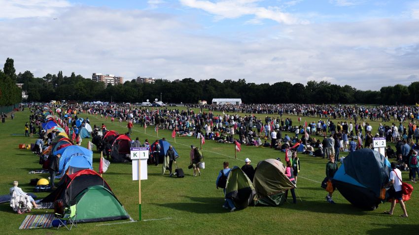 Fans queue to enter The All England Lawn Tennis Club in Wimbledon, southwest London, on July 3, 2017 before play starts on the first day of the 2017 Wimbledon Championships. / AFP PHOTO / Oli SCARFF / RESTRICTED TO EDITORIAL USE        (Photo credit should read OLI SCARFF/AFP/Getty Images)