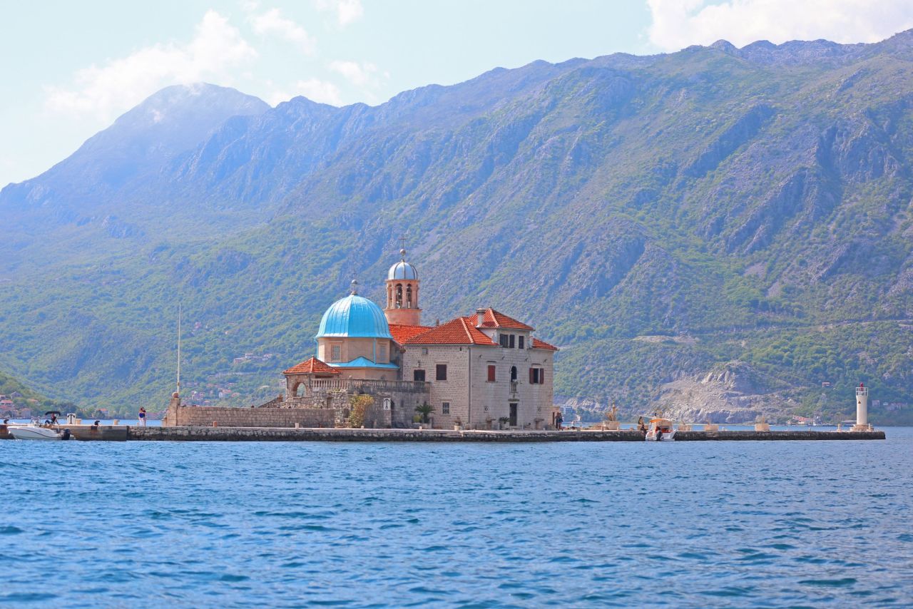 <strong>Island Churches, Kotor: </strong>These two showstopping islands lie off the coast of Perast. Tthey are lush, elegant buildings surrounding by periwinkle blue water.