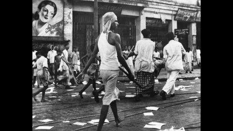 Armed rioters walk through the streets of Calcutta, now known as Kolkata, in August, 1946.  </p><p>Communal violence between Hindus and Muslims broke out during Direct Action Day, called by the Muslim League as a day of strikes, although it was open to different interpretations. The violence lasted for days and it is estimated that at least <a href=