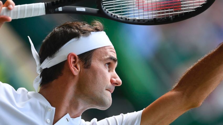 Switzerland's Roger Federer serves against Ukraine's Alexandr Dolgopolov during their men's singles first round match on the second day of the 2017 Wimbledon Championships