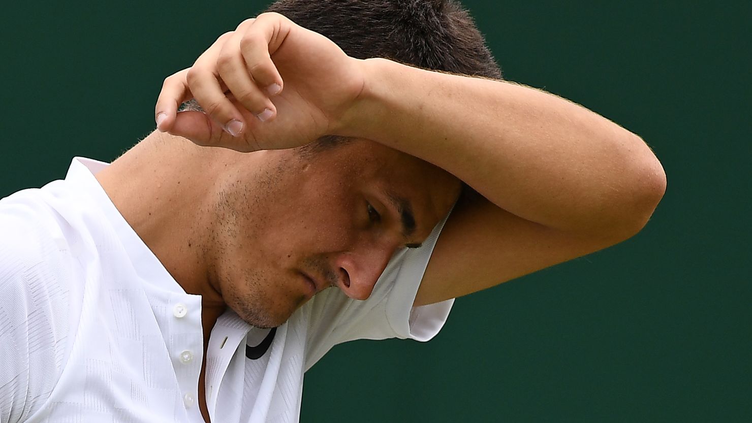 Bernard Tomic crashed out of Wimbledon on Tuesday saying afterwards that he was "bored" of tennis.  