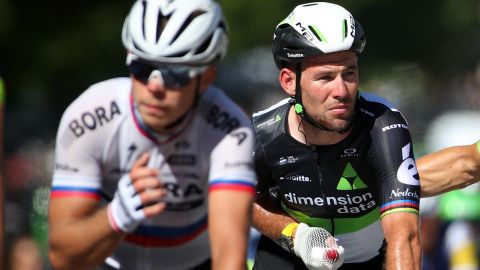 Mark Cavendish (right) is pictured riding for Team Dimension Data.