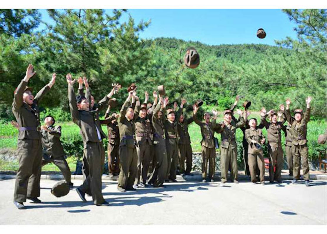 North Korean soldiers celebrate the launch of the Hwasong-14, the country's first tested intercontinental ballistic missile, on July 4, 2017 in this image from North Korean state media.