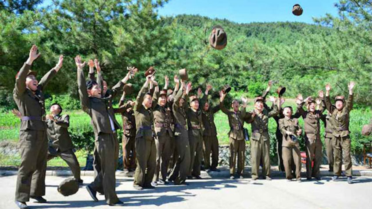 North Korean soldiers celebrate the launch of the Hwasong-14, the country's first tested intercontinental ballistic missile, on July 4, 2017 in this image from North Korean state media.