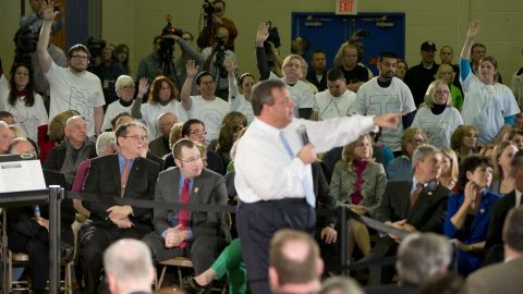 Demonstrators stand with the word "Bridgegate" spelled out on their shirts during a town-hall event in Flemington, New Jersey, in March 2014.