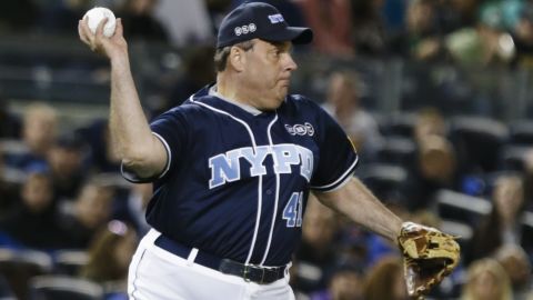 Christie throws to first base during the 