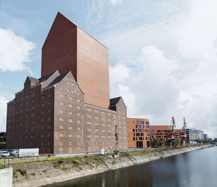 The tower of the state archive of North Rhine Westphalia rises 249 feet out of a historic brick warehouse. 