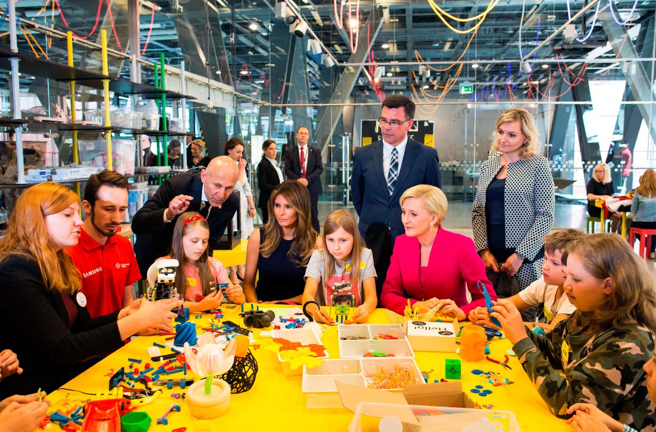 First ladies Melania Trump and Agata Kornhauser-Duda play with children as they visit the Copernicus Science Centre in Warsaw on July 6.