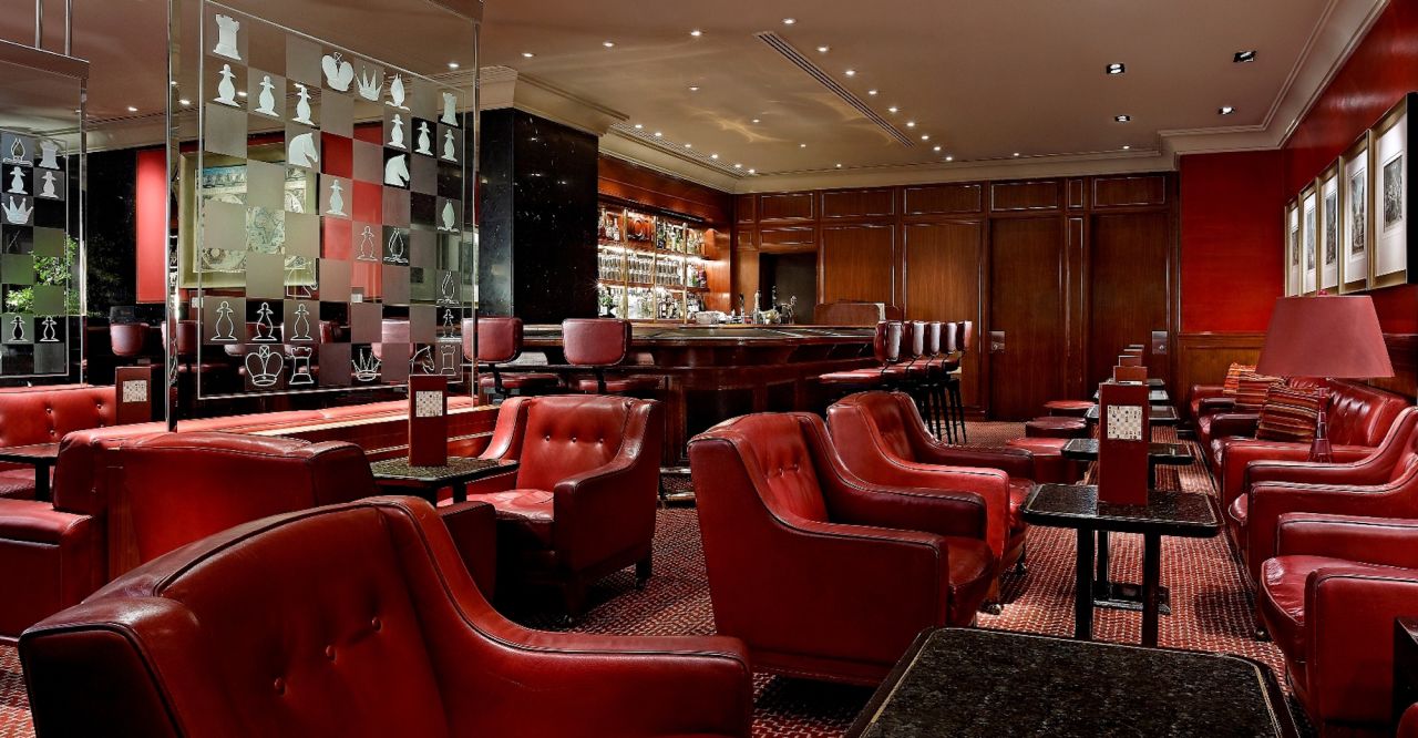 <strong>The Captain's Bar:</strong> The surroundings have been updated for wear and tear, but the place retains a gentleman's club vibe, with its leather booths, red accents and wood fixtures. 